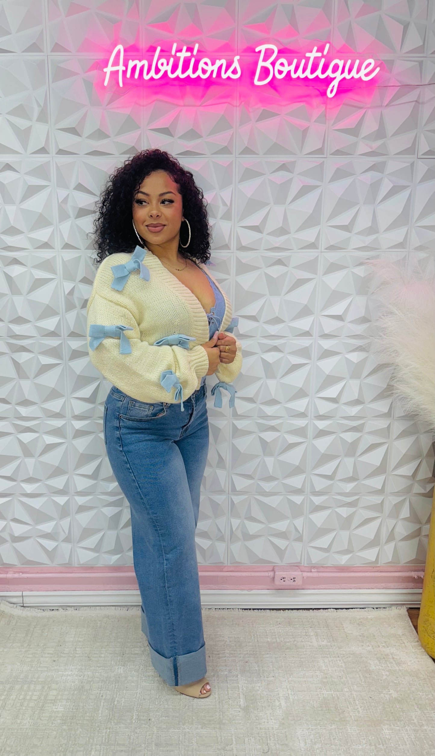 Bows in blue cardigan