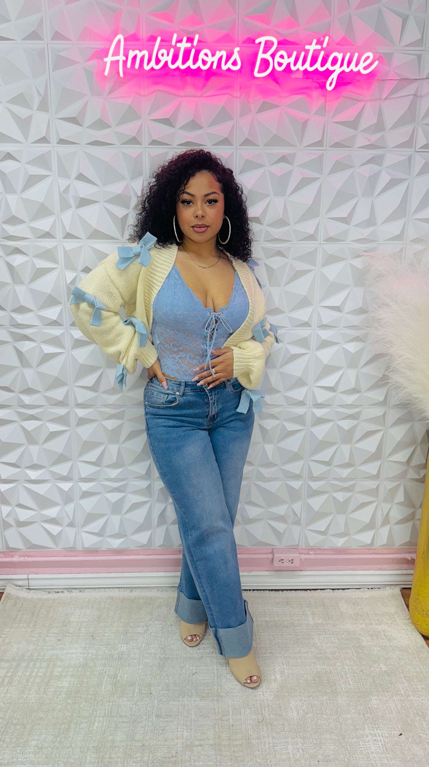 Bows in blue cardigan